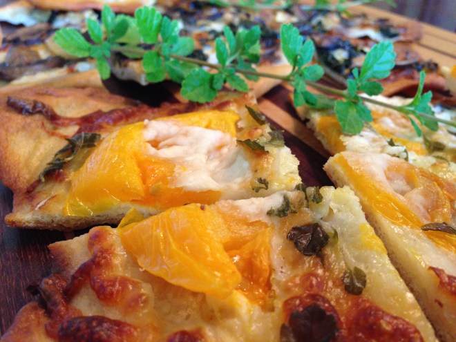Yellow heirloom tomatoes with fresh rosemary, oregano, garlic and shaved parmesan cheese.